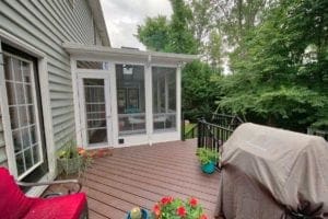 Sunroom with Attached Wooden Deck and Outdoor Grill in Charlottesville, VA