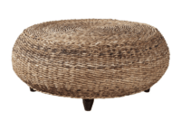 Round, woven rattan ottoman with a natural finish, supported by four short, dark wooden legs—perfect for adding a touch of warmth and texture to your sunroom decorating.