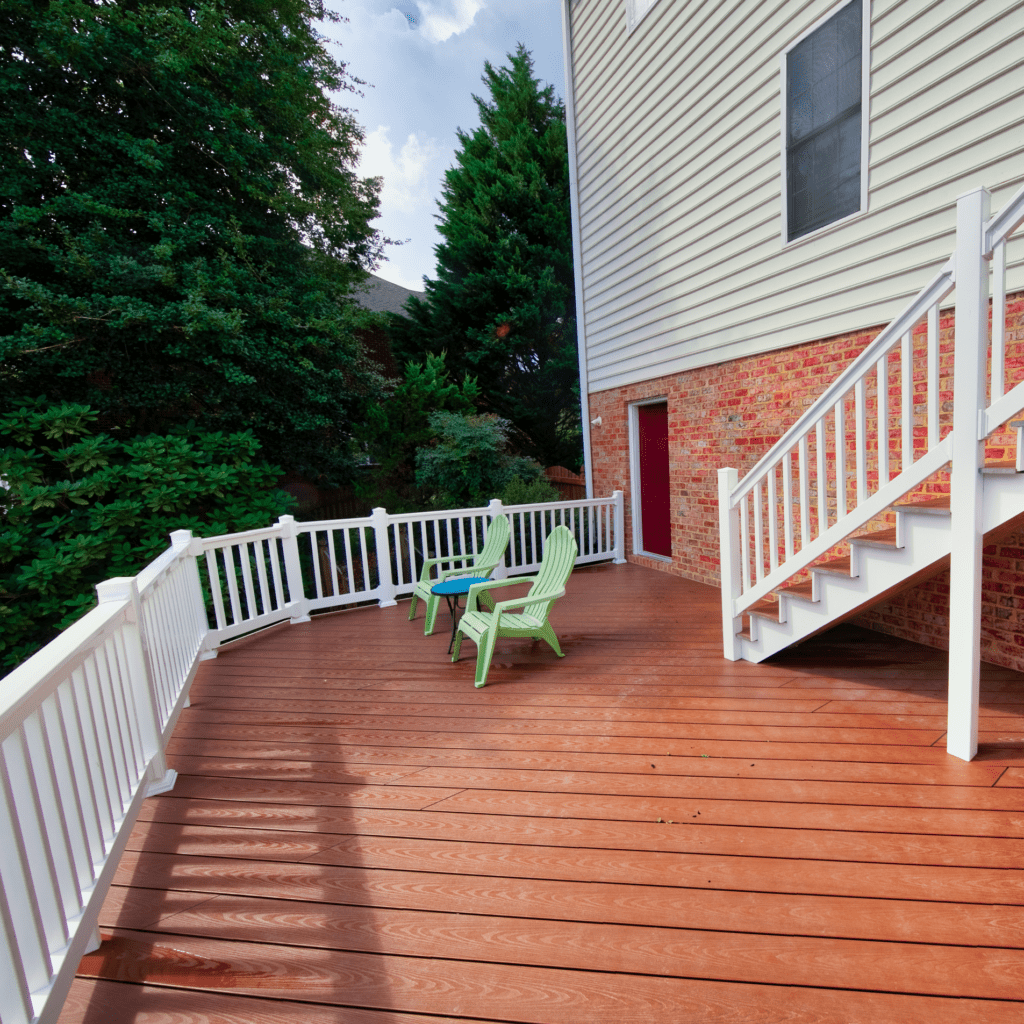 Beautiful wooded deck and stairs built by Deck Creations, overlooking the backyard and trees.