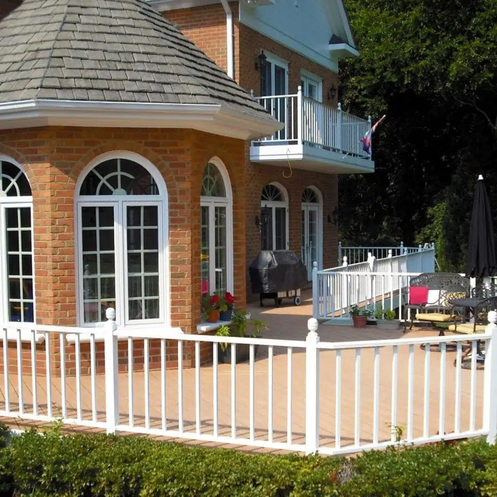 Custom Patio Deck with White Railing on a Brick House in Virginia.