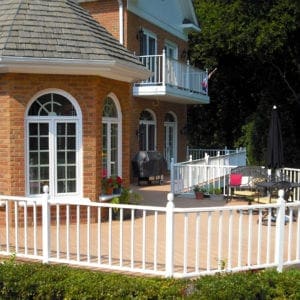 Custom Patio Deck with White Railing on a Brick House in Virginia.