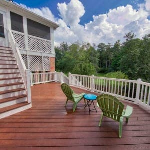 Beautiful wooded deck and stairs built by Deck Creations, overlooking the backyard and trees.