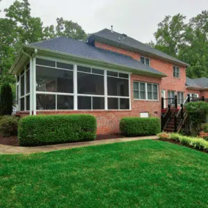 Sunroom Attached to Brick House in Richmond, VA designed by Deck Creations.