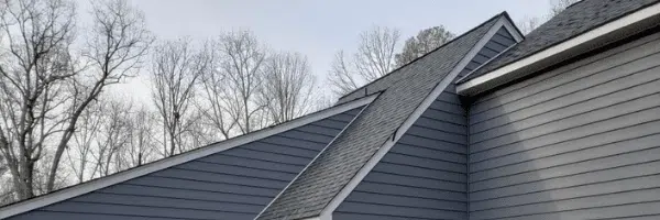 Siding of a house. How to Assess Your Home Siding with Deck Creations.