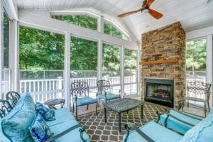 Large Screen Porch with Fireplace by Deck Creations.