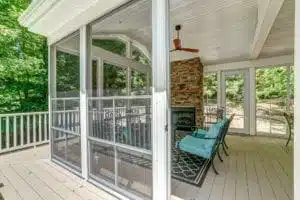 Large Screen Porch with Fireplace by Deck Creations.