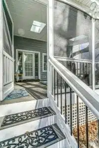 Screen porch with skylight, vinyl railing and composite (Timbertech) decking designed by Deck Creations.