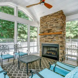 Large Screen Porch with Fireplace by Deck Creations.