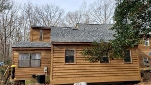 Before picture of a home with brown siding.