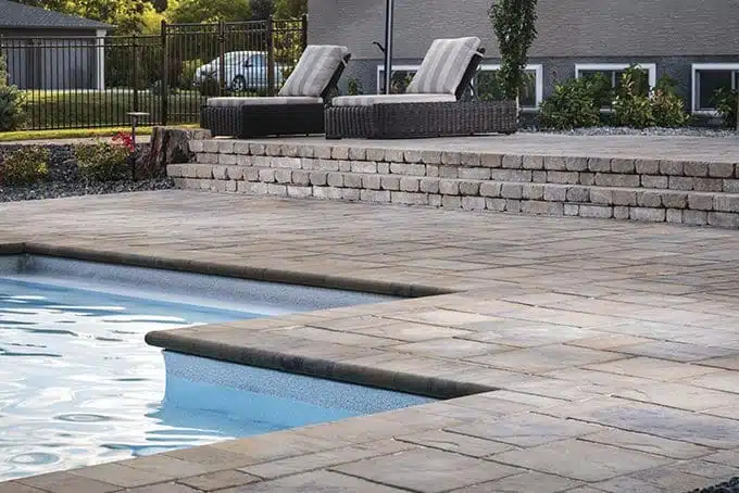 Pool with Stone Hardscape designed and built by Deck Creations.