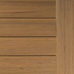 Close-up of wooden texture featuring horizontal planks on the left and vertical trim on the right. The wood is light brown with subtle grain lines.