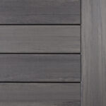 Close-up of a gray wooden deck panel featuring horizontal planks with a smooth, matte finish, showcasing the subtle wood grain texture.