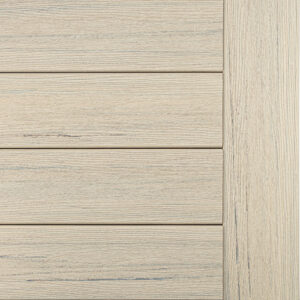 Close-up of light wood paneling often seen on a deck, featuring horizontal planks with a vertical border on the right.