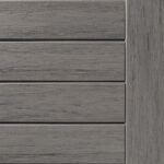 Close-up of a gray wooden deck panel with horizontal slats and visible grain texture.